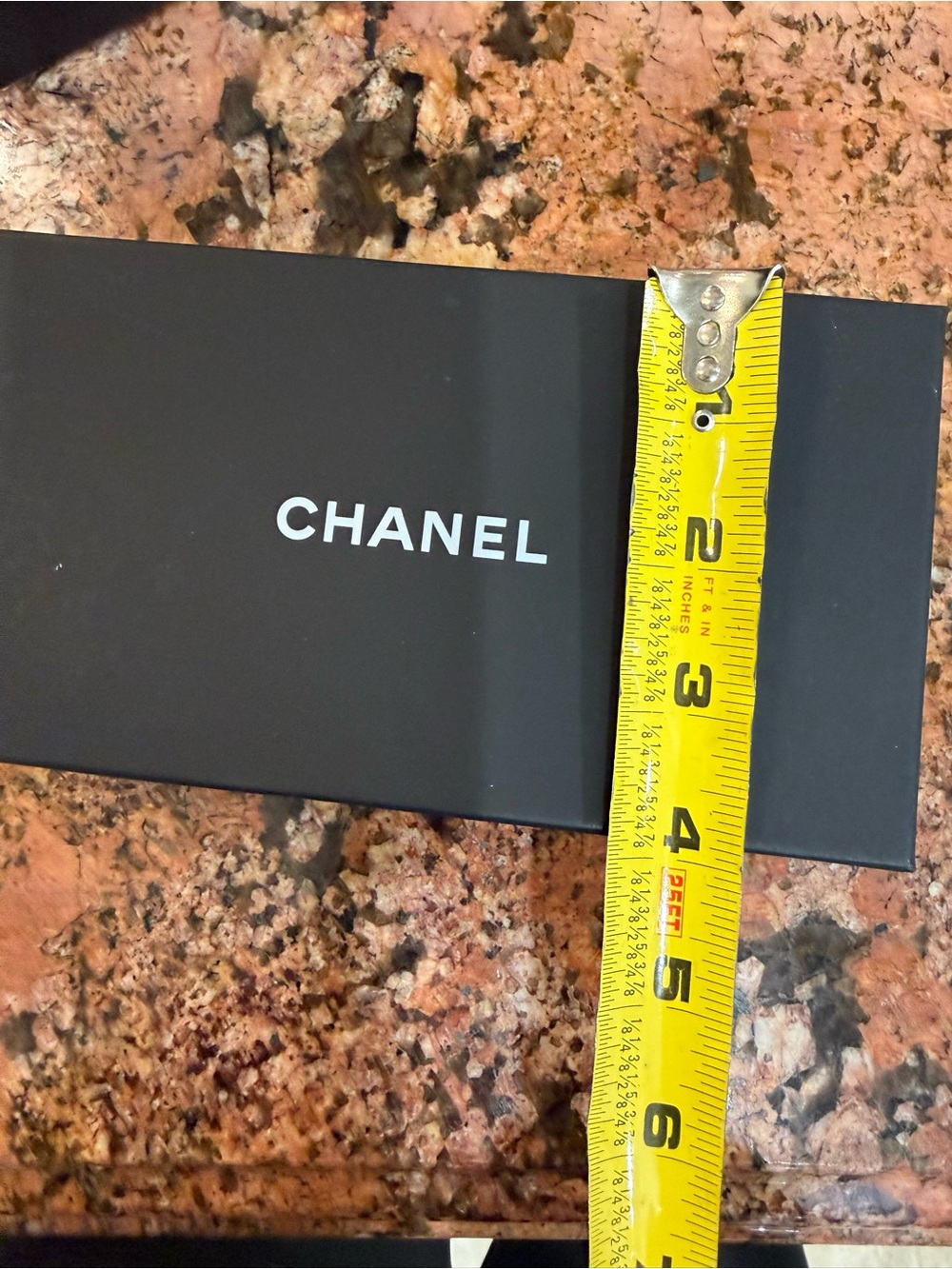 CHANEL Black Box with White Logo and Yellow Tape Accent